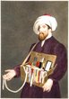 Moroccan Jew with beard and turban carrying a box containing ribbons,scissors,mirrors,ect.